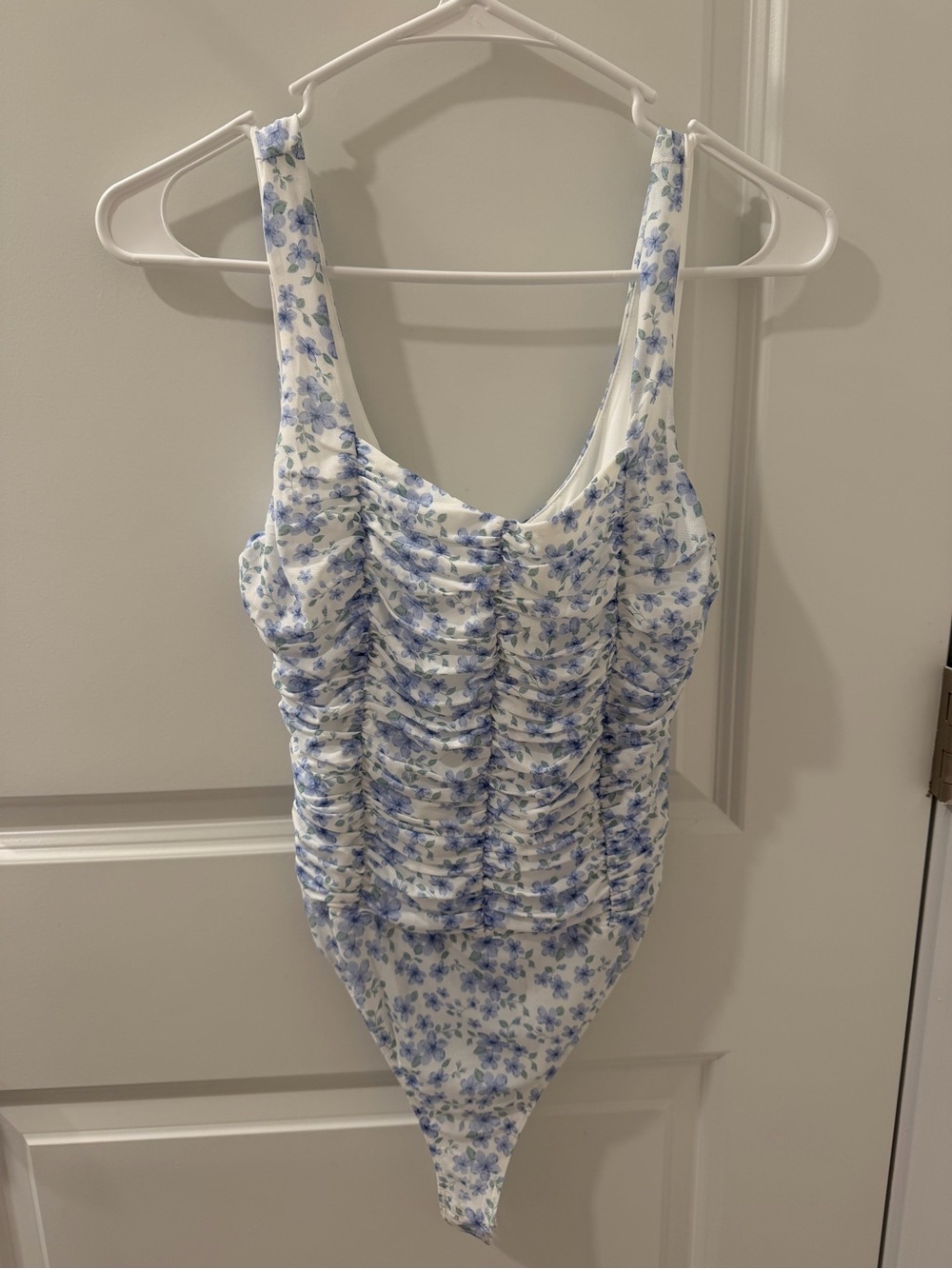 Lulu's White Bodysuit with Blue Floral Print and Ruching